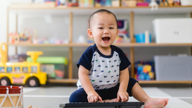 baby playing toy piano