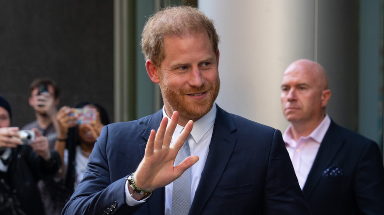 Prince Harry smiling and waving