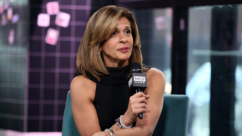 Hoda Kotb holding a microphone