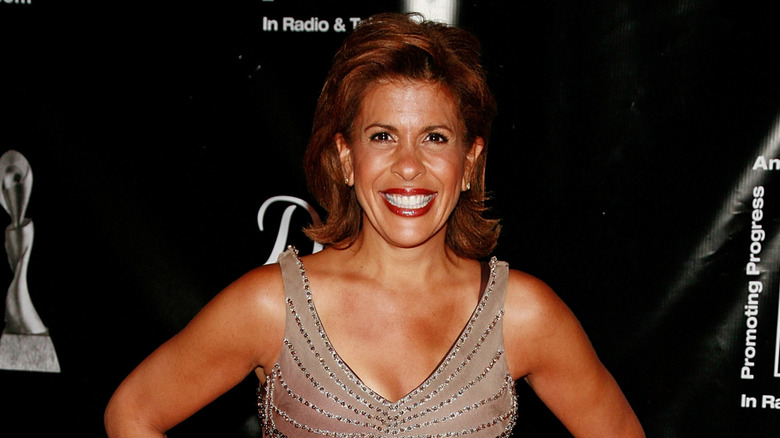 Hoda Kotb smiling in a sparkly dress