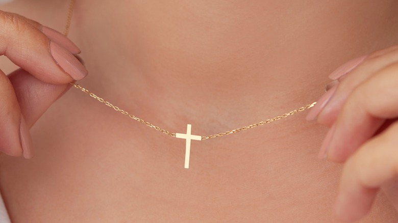 Woman with gold cross necklace