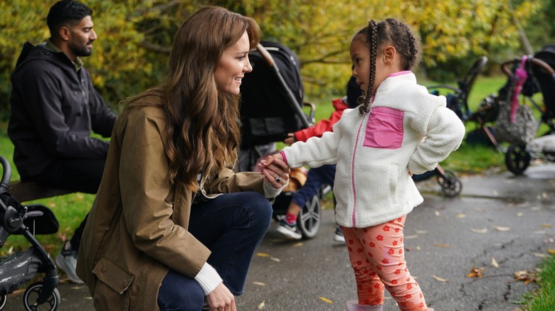 Kate Middleton talking to a child