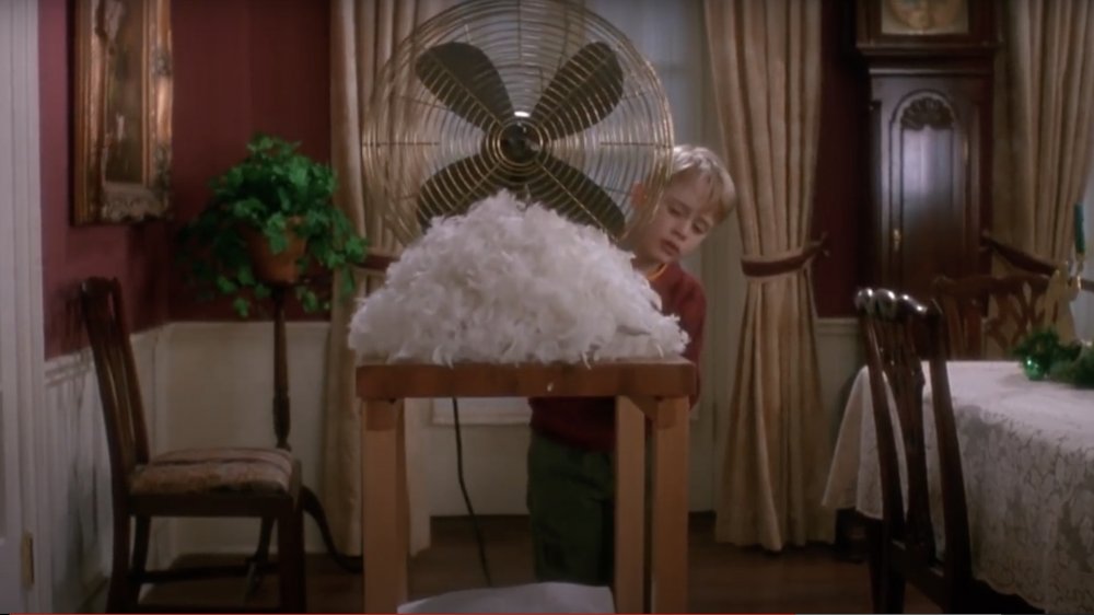 Kevin setting up feathers and a fan in Home Alone