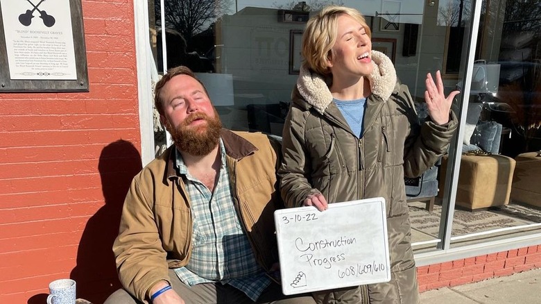 Ben and Erin Napier pose on the set of Home Town