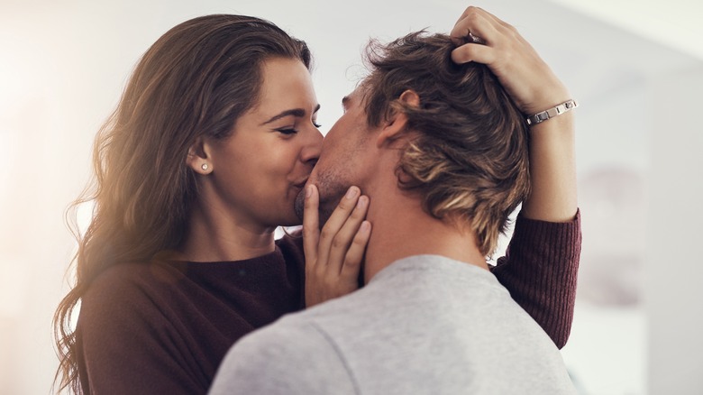 Couple kissing at home