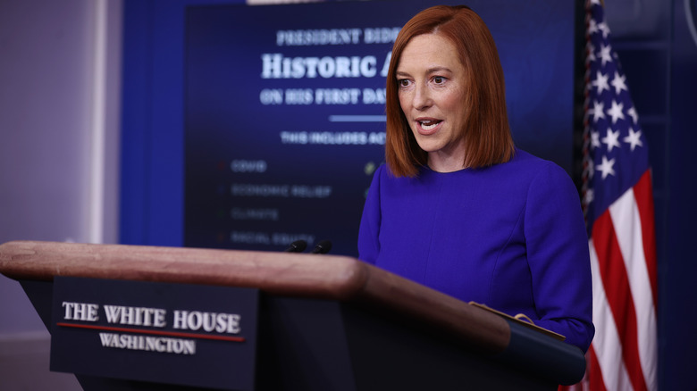 Jen Psaki speaking behind White House podium