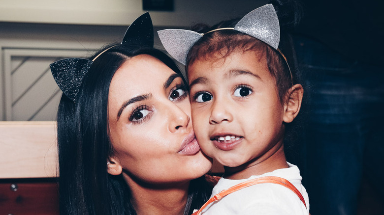 Kim Kardashian West, North West posing in cat ears