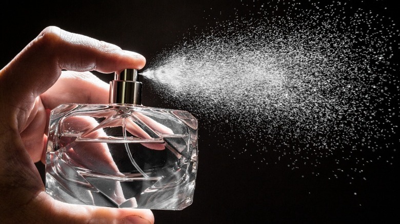 A perfume bottle spraying
