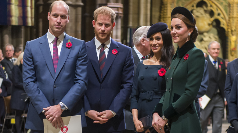 Prince Harry and Prince William smiling with Meghan Markle and Princess Catherine