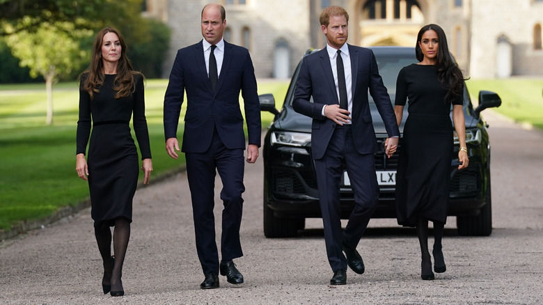 Prince Harry and Prince William walking with Meghan Markle and Princess Catherine