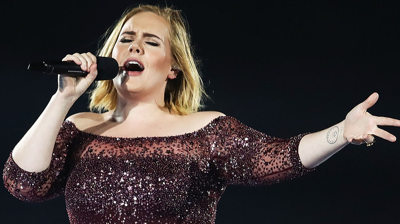 Adele singing with microphone