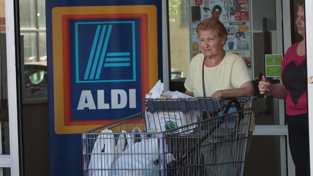 Shoppers leaving an Aldi store