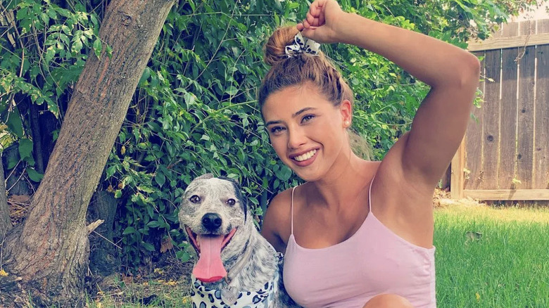 April smiling with her dog