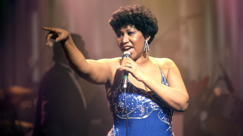 Aretha Franklin performing on stage