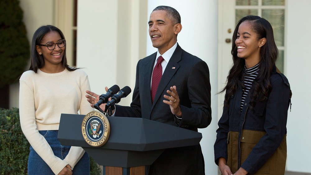 Sasha, Malia, and Barack Obama