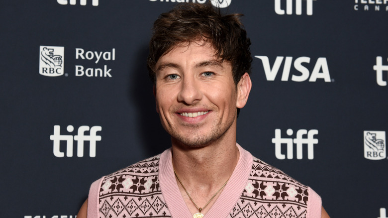 Barry Keoghan smiling in pink sweater