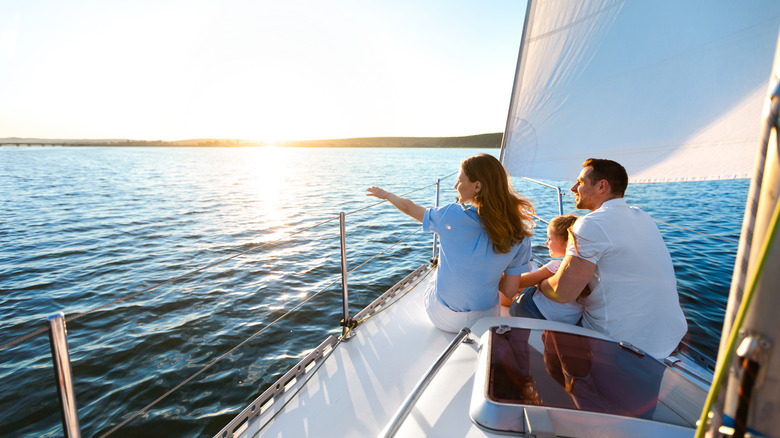 Family on a boat looking at the horizon