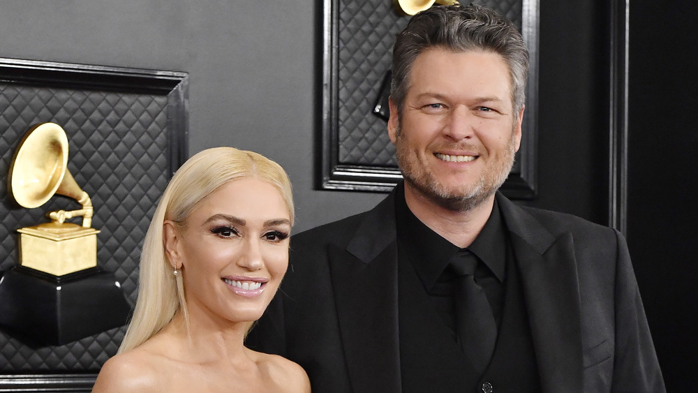 Gwen Stefani and Blake Shelton posing at the Grammy awards