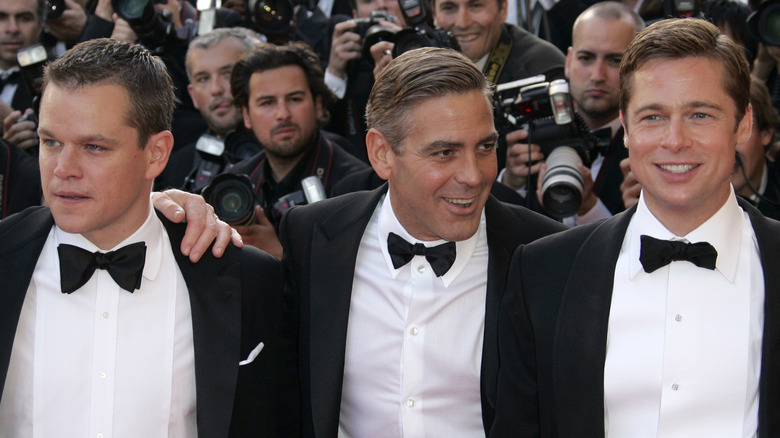 Matt Damon, Brad Pitt and George Clooney pose at the premiere of "Ocean's 13" during the 60th Cannes Film Festival in France (2007)