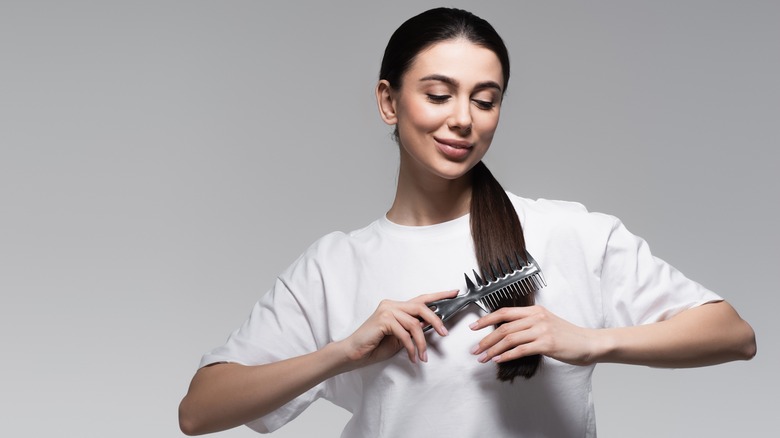 Woman combing her hair