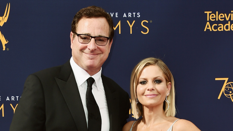 Candace Cameron Bure and Bob Saget at an event. 