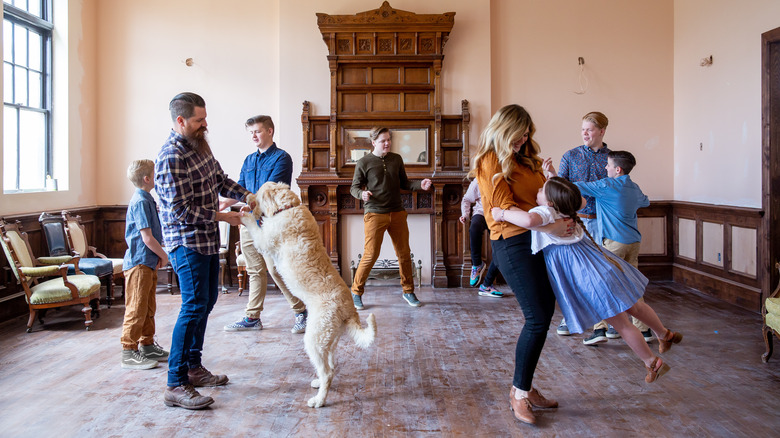 Meredith family in living room with dog