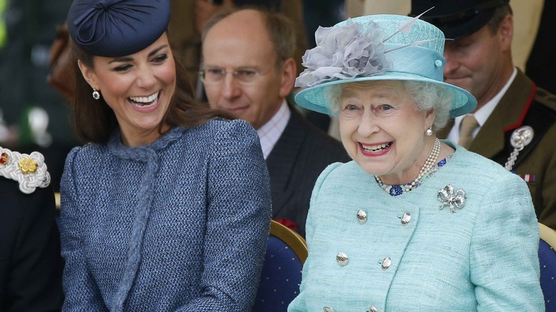 Kate Middleton laughing with Queen Elizabeth II