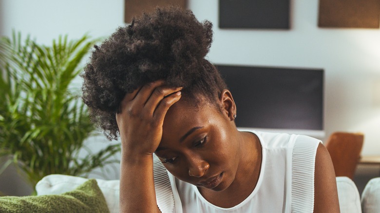 Woman hand to hair