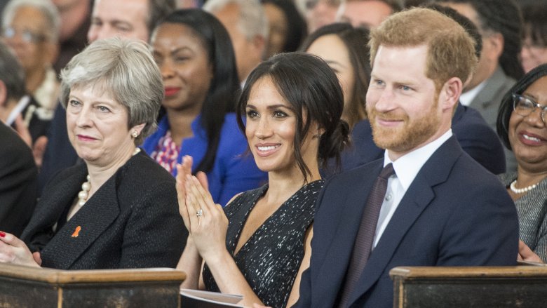 Theresa May with Meghan and Harry