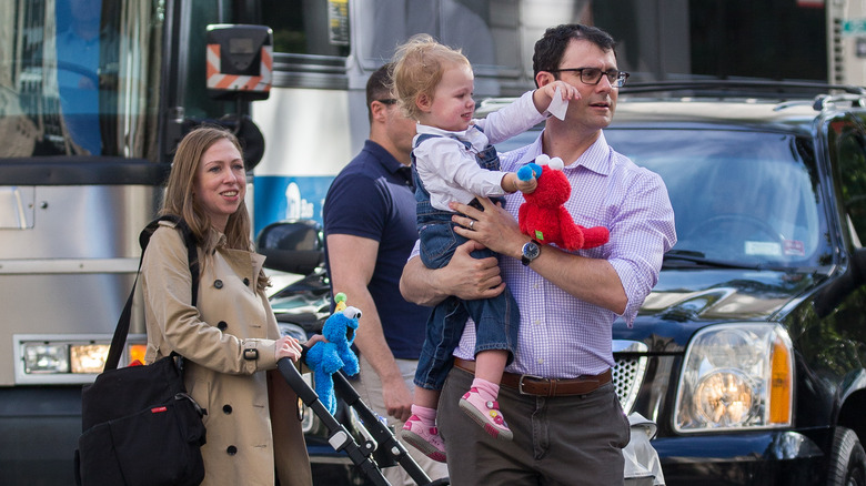 Chelsea Clinton and her husband on a walk with their children