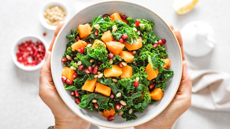 Kale salad in a white bowl