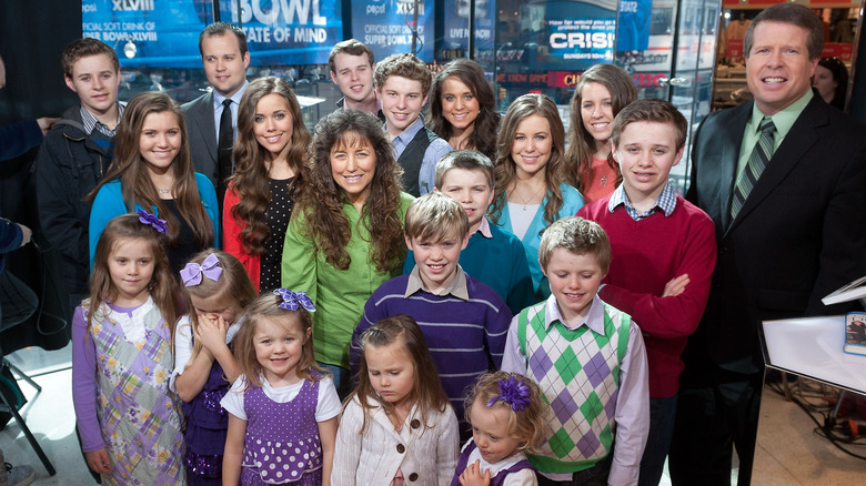 The Duggar family poses together