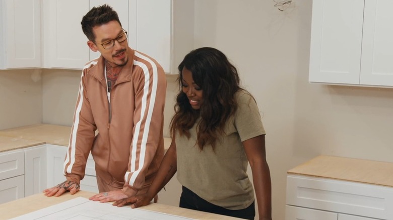 David Bromstad and Tiffany Brooks behind kitchen island