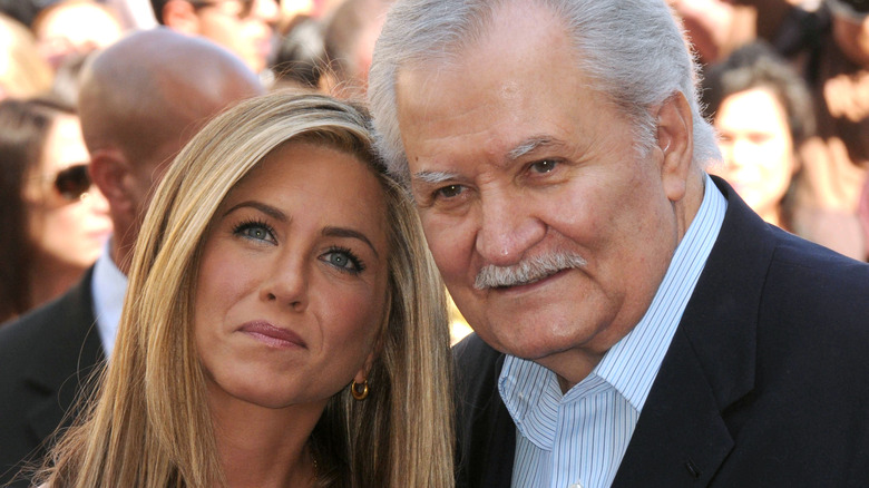 John and Jennifer Aniston posing together