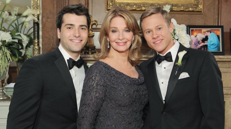 Will and Sonny posing with Marlena at wedding