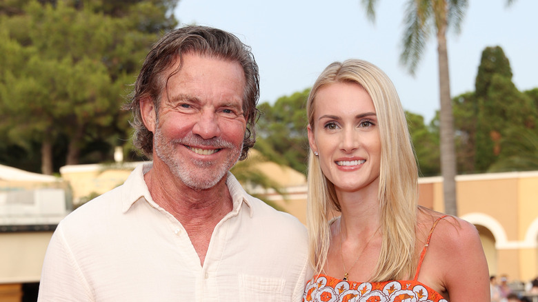 Dennis Quaid with long hair; pictured with wife