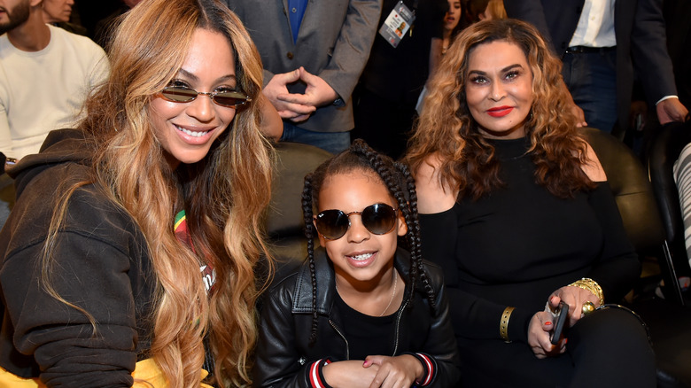 Beyonce, Blue Ivy, and Tina Lawson at NBA game