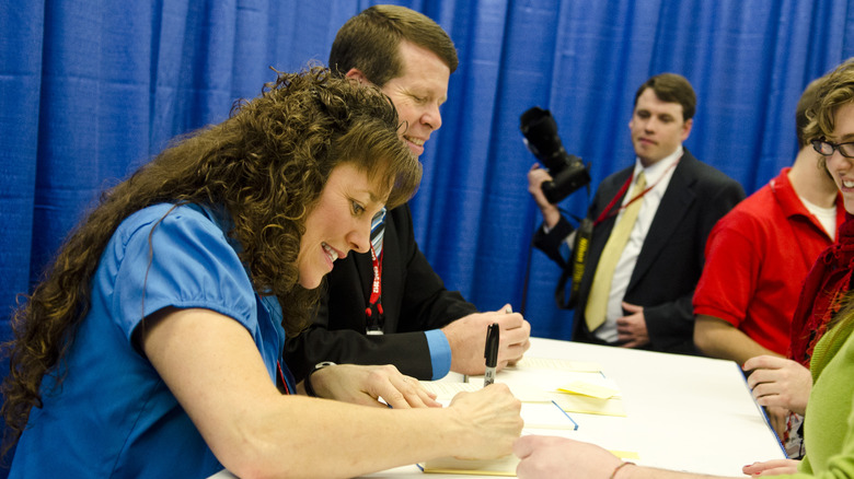 Michelle and Jim Bob Duggar signing books