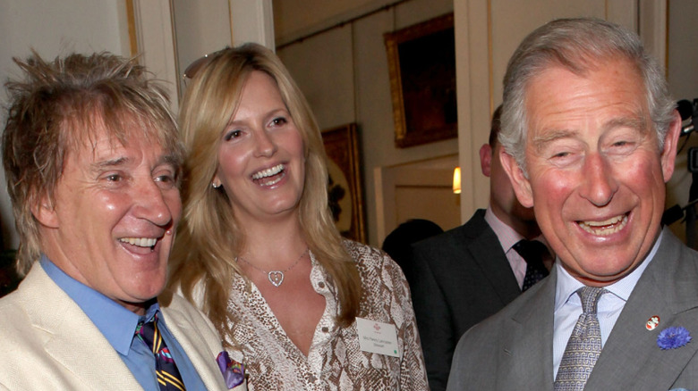 Rod Stewart and Penny Lancaster smile with Prince Charles at The Prince's Trust 35th Anniversary Reception at Clarence House in London (2011)