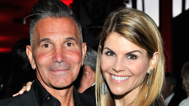 Lori Loughlin and Mossimo Giannulli at an event. 