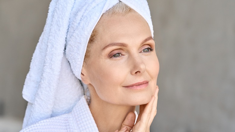 woman doing skincare routine, woman washing face