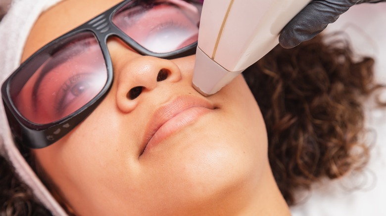 Woman receiving laser hair removal