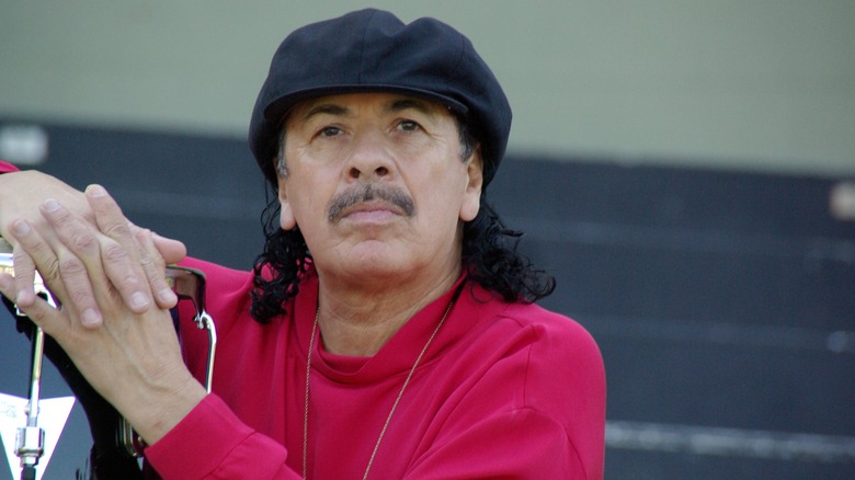 Carlos Santana posing 