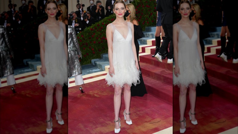 Emma Stone posing in white dress at Met Gala