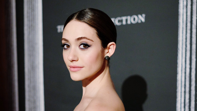 Emmy Rossum looking over her shoulder