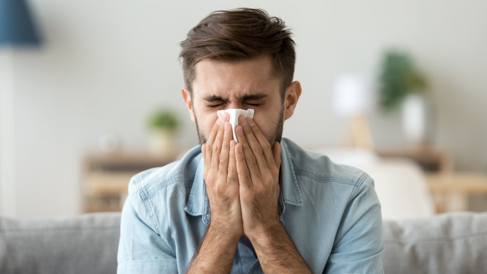 Man sneezing