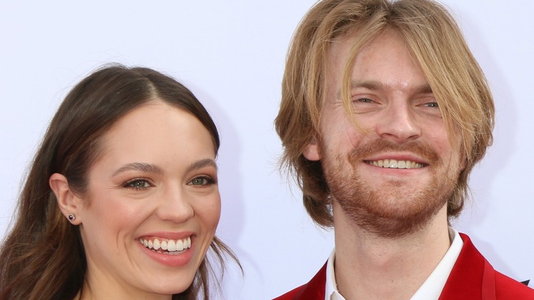 Claudia Sulewski and Finneas O'Connell smiling