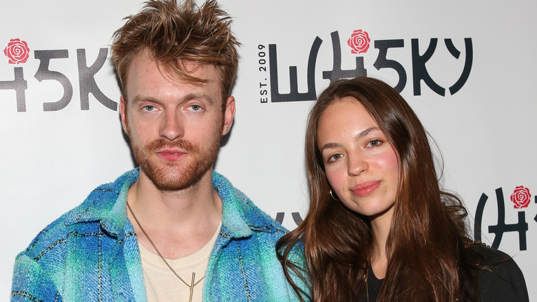 Finneas O'Connell and Claudia Sulewski smiling