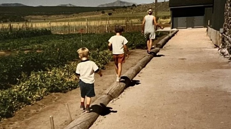 General Hospital's Kristina Wagner and her sons walking atop a log