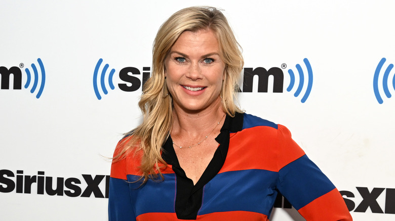 Alison Sweeney smiling for a photograph. 